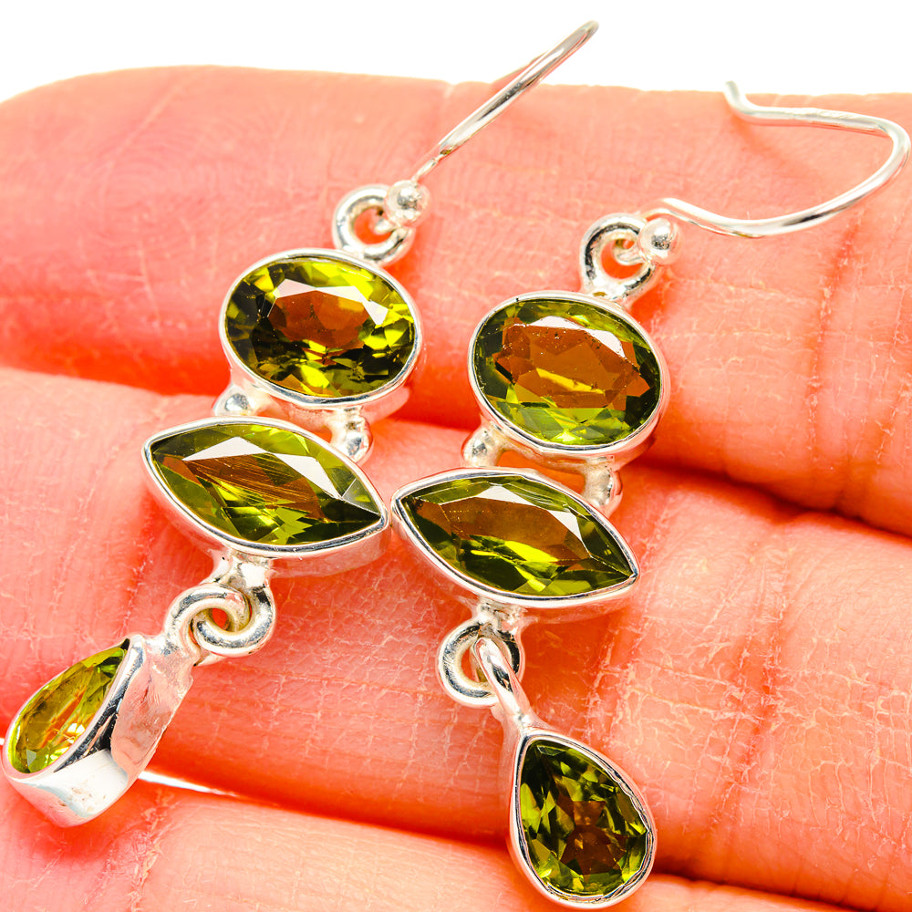 Sterling silver peridot oval drop earrings with three stacked green stones