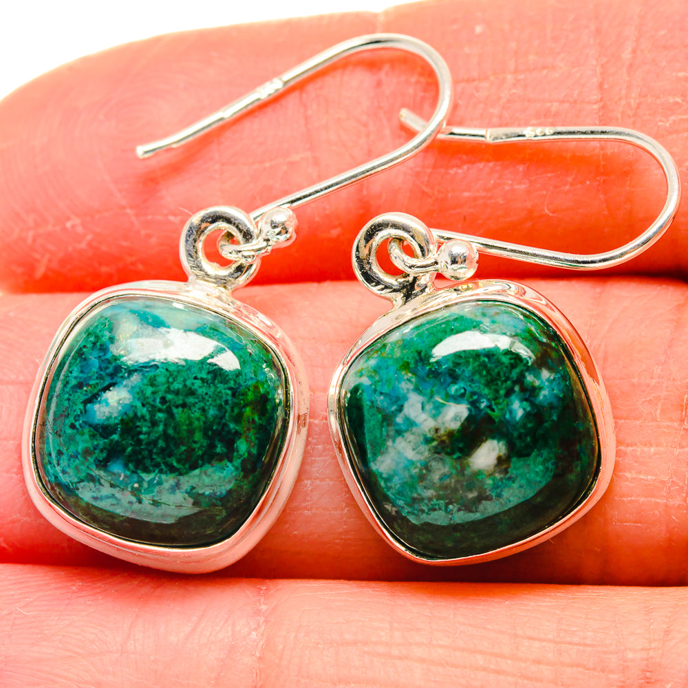 Close-up of sterling silver chrysocolla oval green stone drop earrings with hooks