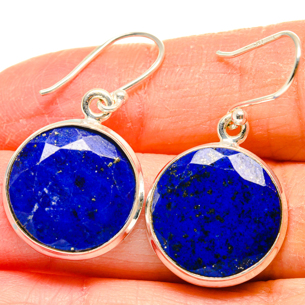 Round lapis lazuli earrings with blue stone bezel, sterling silver hooks—close view