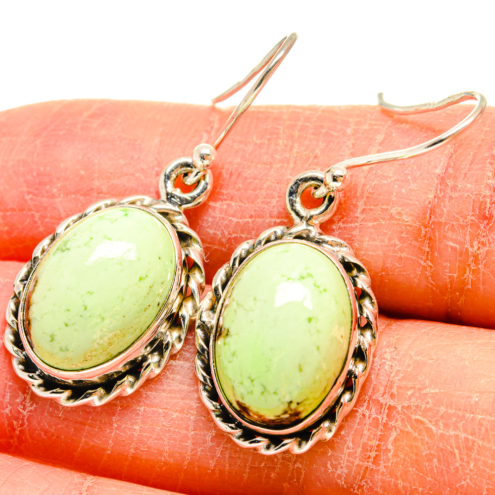 Oval green chrysoprase earrings in sterling silver with scalloped frames and fishhook closures