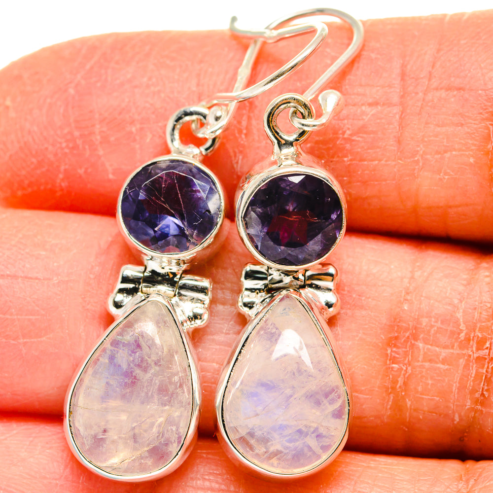Sterling silver earrings with round purple-toned stones and iridescent teardrop dangles