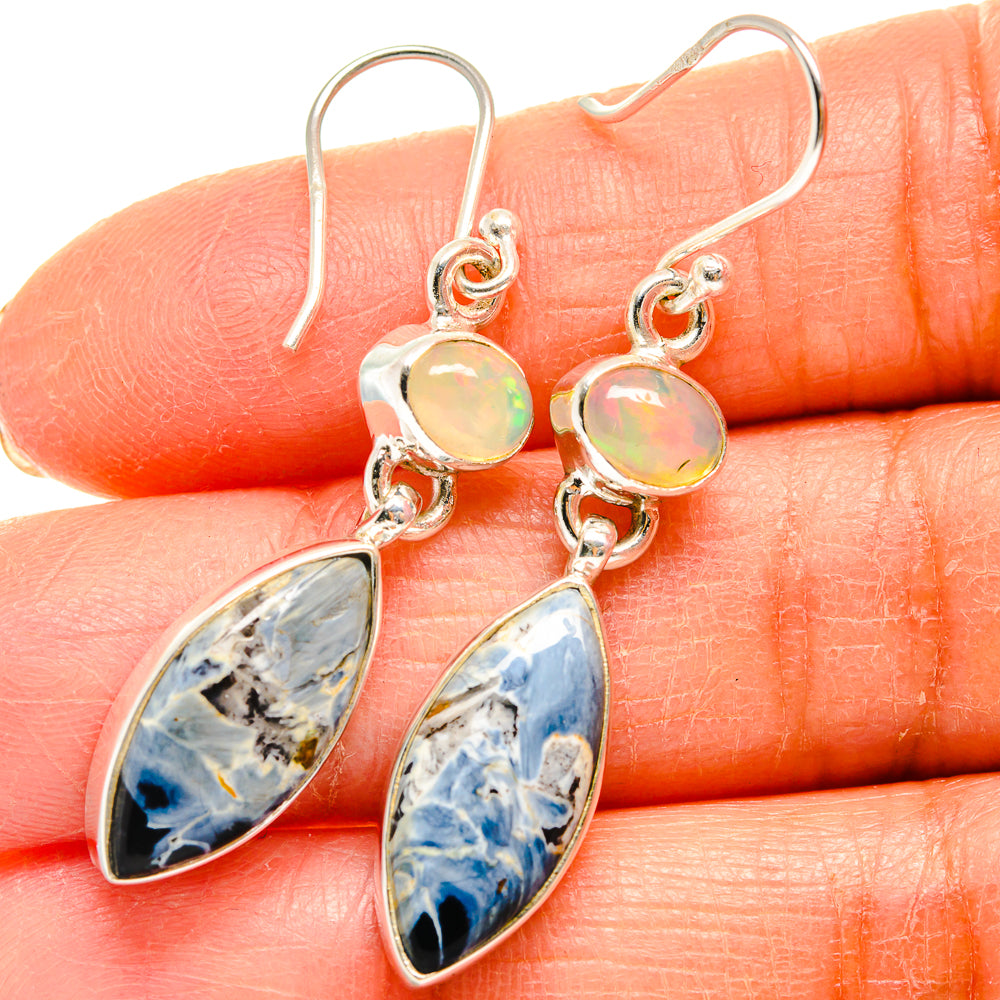 Sterling silver drop earrings with round iridescent opal top and blue pietersite drop