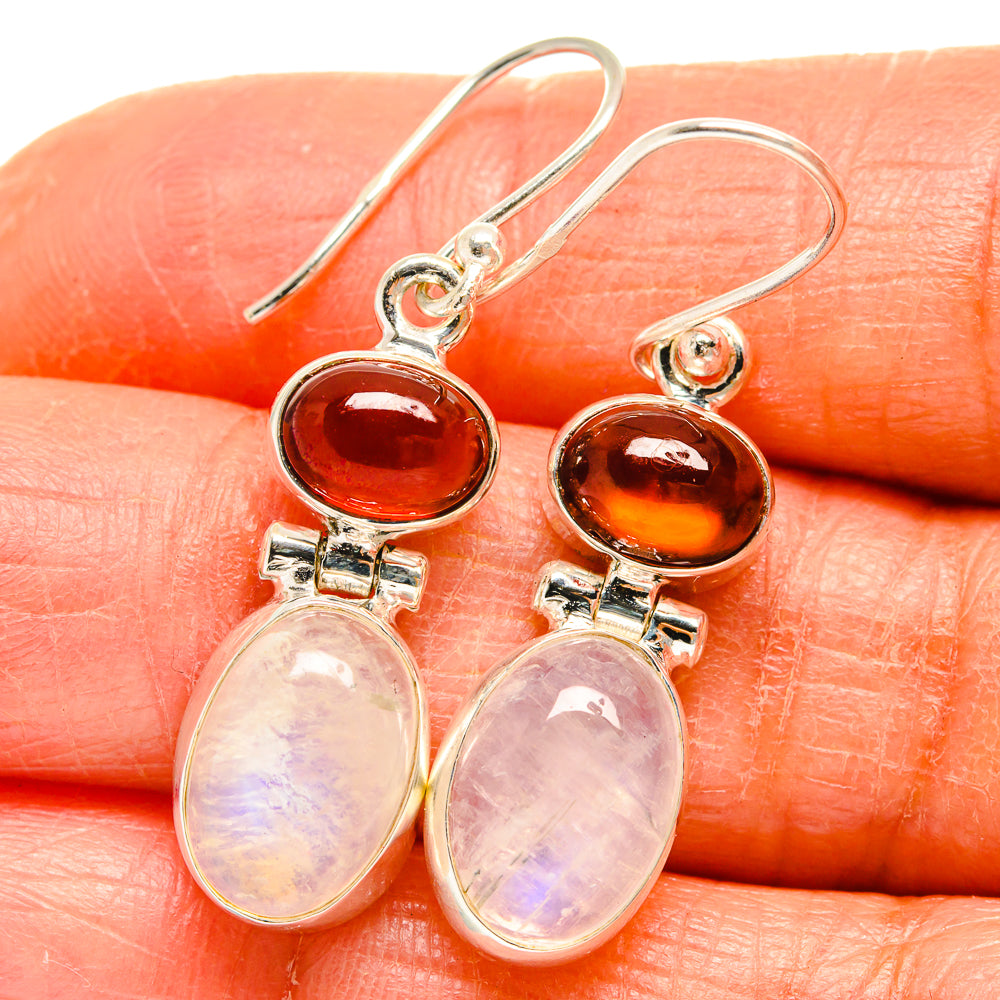 Sterling silver dangle earrings with dark red round stones and pale pear-shaped moonstones