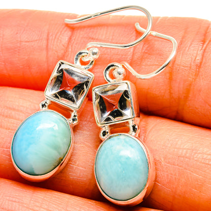 Sterling silver earrings with blue larimar-style oval stones and square settings