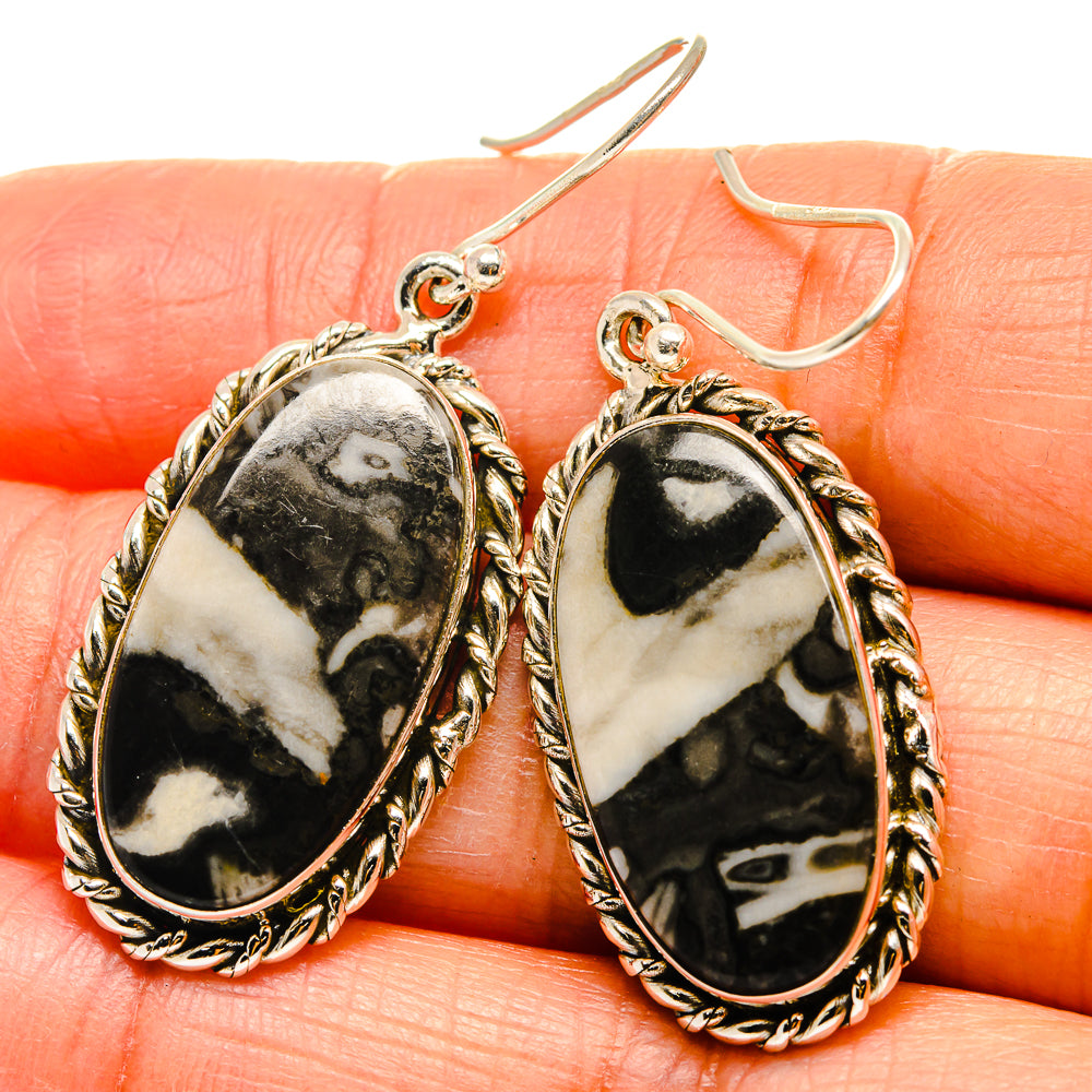 Oval black-and-cream pinolith jasper drop earrings with ornate 925 silver bezels