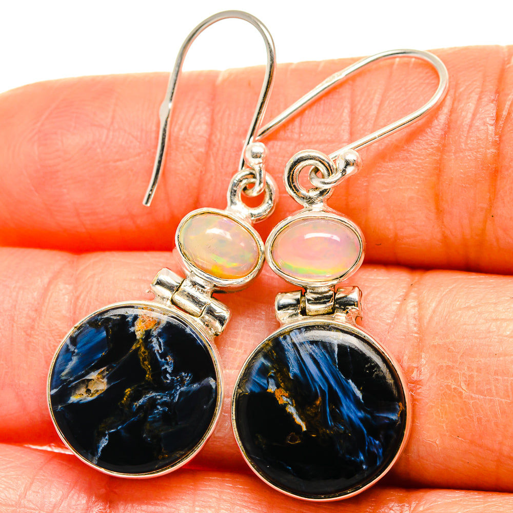 Sterling silver drop earrings with round light opal caps and dark blue pietersite discs