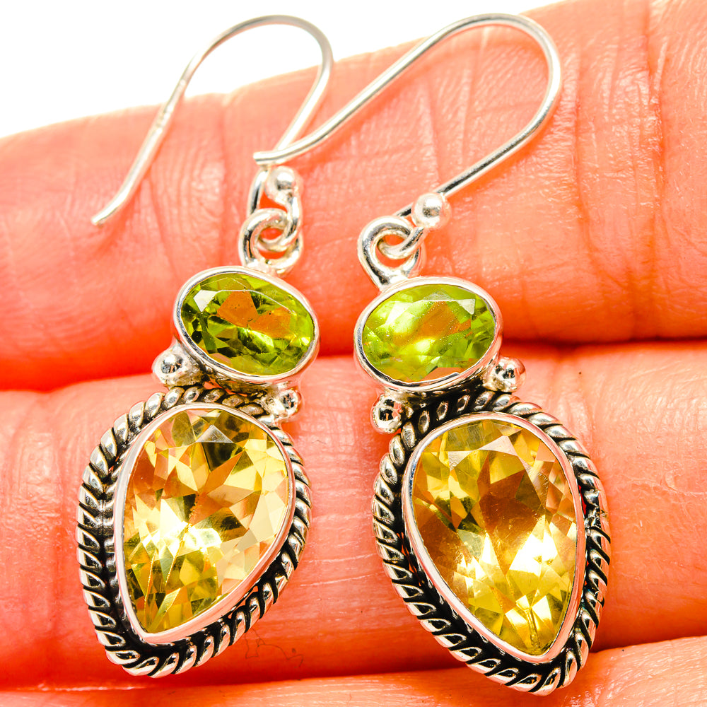 Sterling silver dangle earrings, green oval and teardrop yellow gemstones with prongs