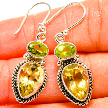 Sterling silver dangle earrings, green oval and teardrop yellow gemstones with prongs
