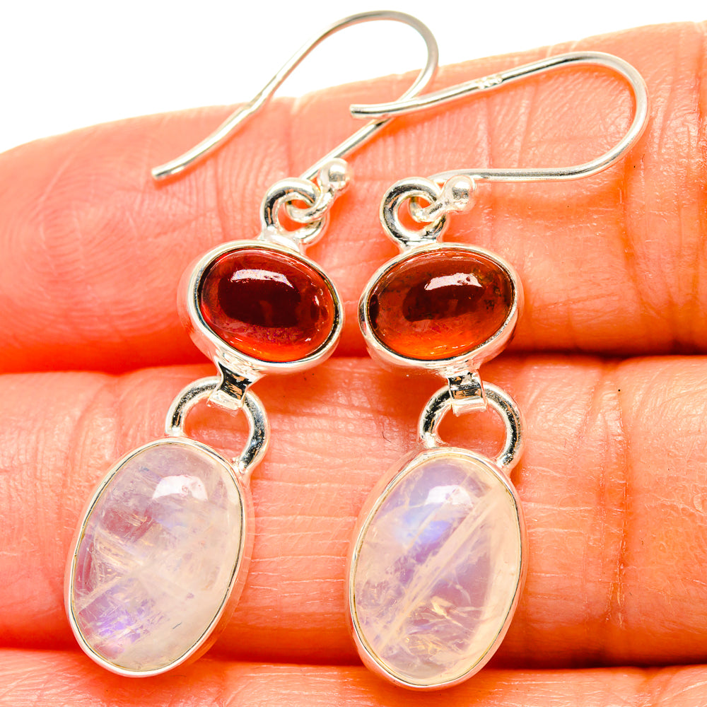Sterling silver drop earrings with red cabochon tops and oval iridescent moonstone drops