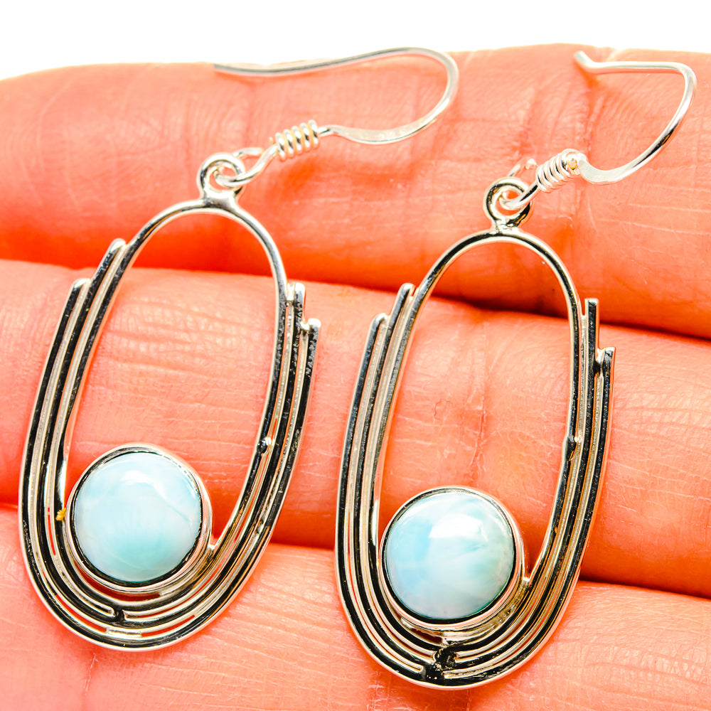 Hoop drop earrings in sterling silver with blue oval cabochon and triple-stripe setting