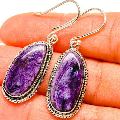 Charoite oval drop earrings in 925 sterling silver, rope-edged bezel, french hooks