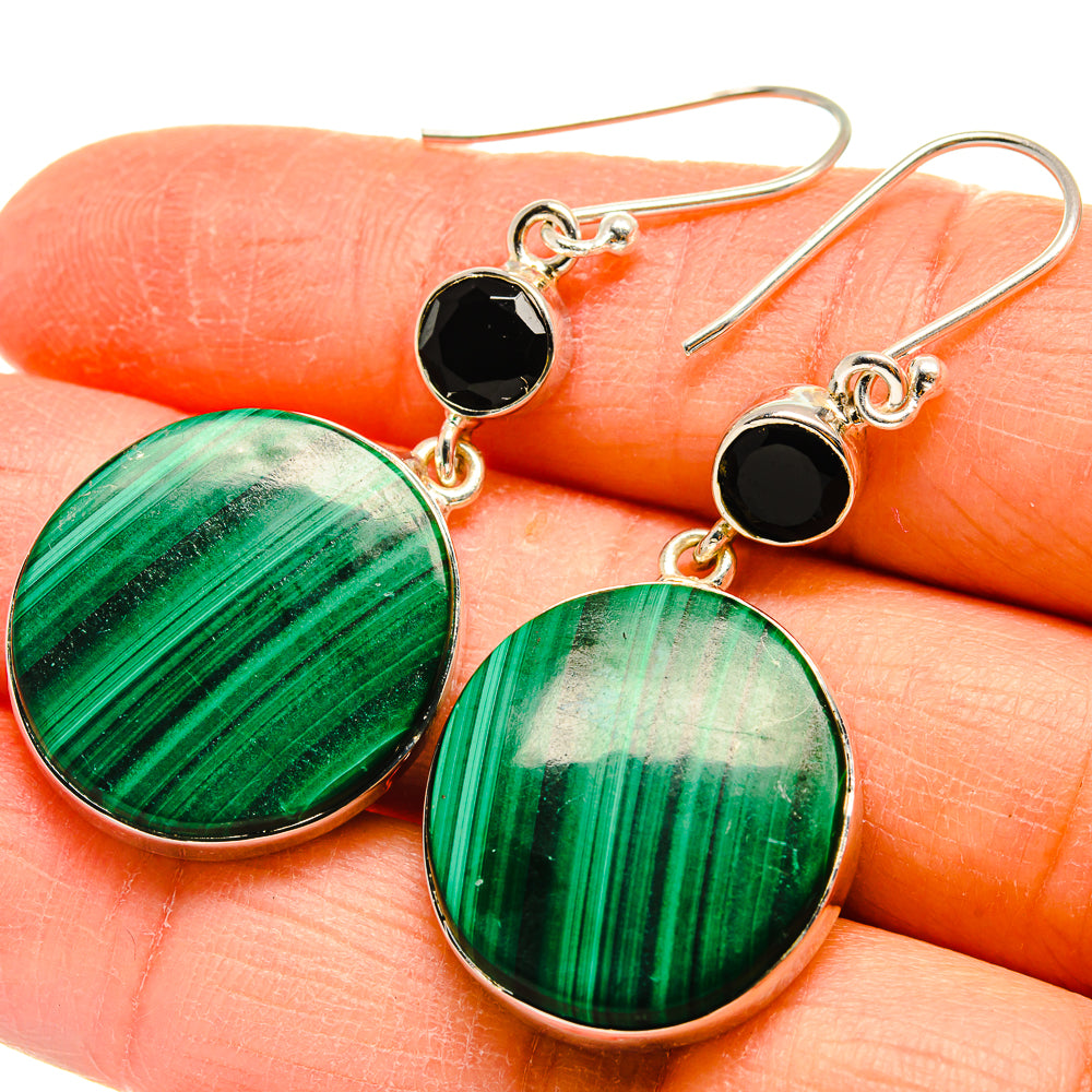 Close-up: round malachite and black onyx drop earrings with sterling silver hooks