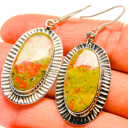 Oval unakite and carnelian drop earrings in 925 sterling silver, close-up on hooks
