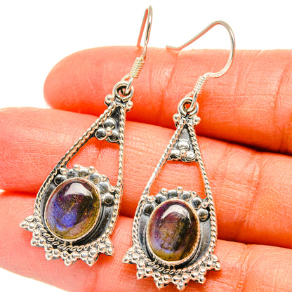Labradorite drop earrings with ornate silver settings, purple-blue oval stones and fishhook