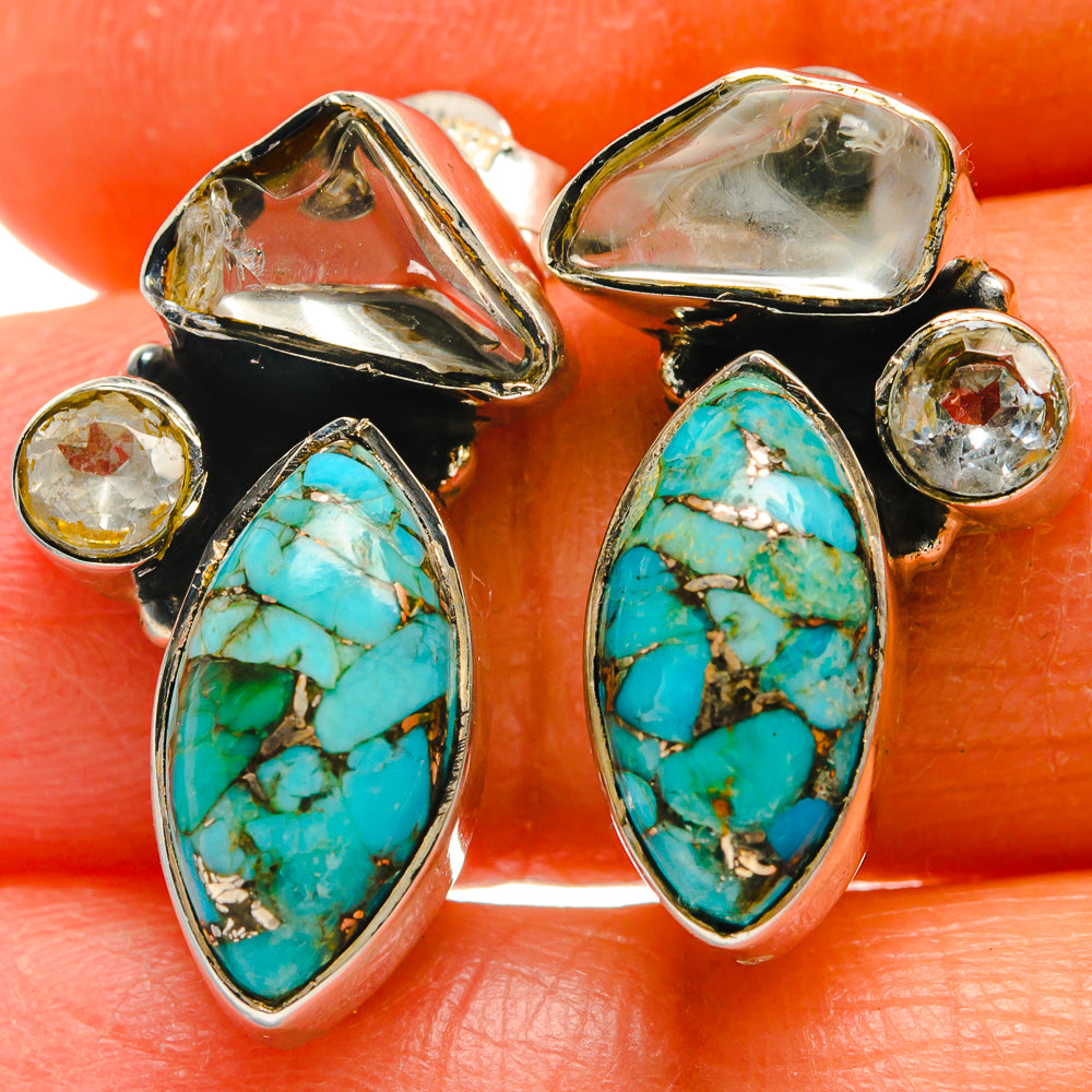 Turquoise oval cabochon drop earrings in silver with black backing and clear round accents