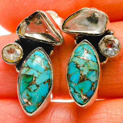 Turquoise oval cabochon drop earrings in silver with black backing and clear round accents
