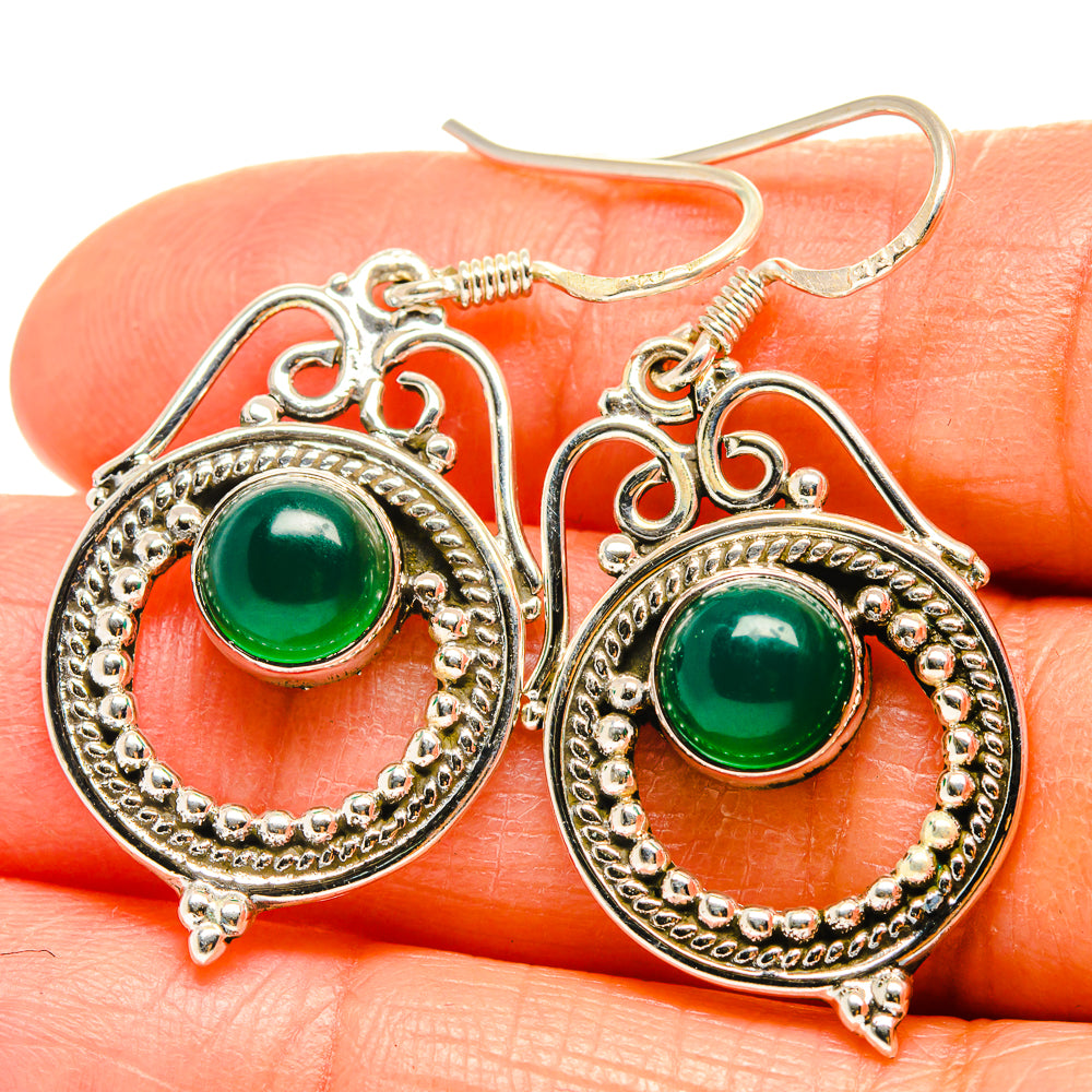 Green onyx earrings, ornate silver round settings with dangling teardrop frames
