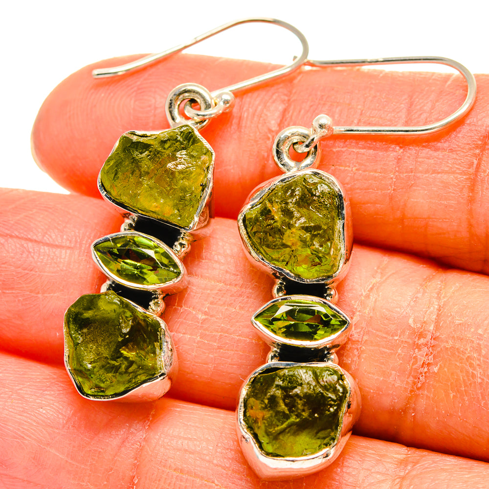 Sterling silver peridot drop earrings with three rough green stones and heart-like shapes
