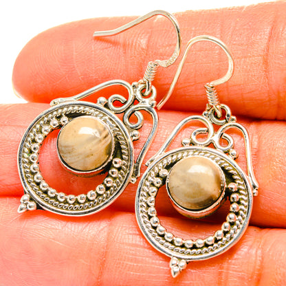 Silver-tone round cabochon jasper earrings with decorative border and fishhook ear wires