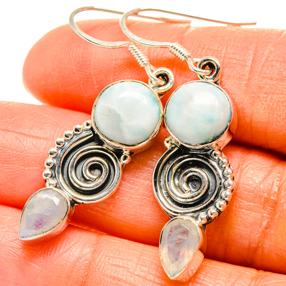 925 sterling silver earrings with blue round stones, spiral accents, and iridescent drops