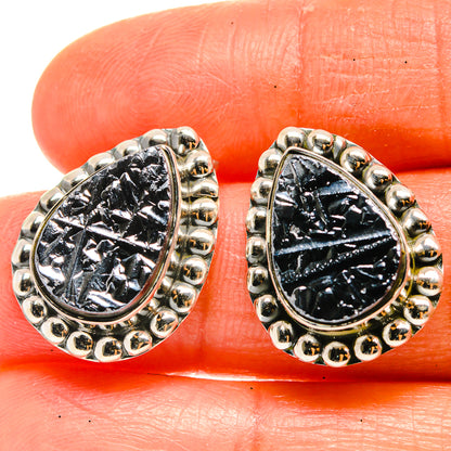 Teardrop shungite earrings with black stone centers and silver-tone bead trim