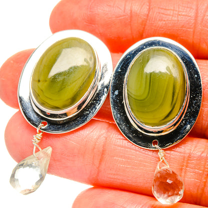 Oval olive green gemstone earrings with silver bezel and dangling clear quartz drops