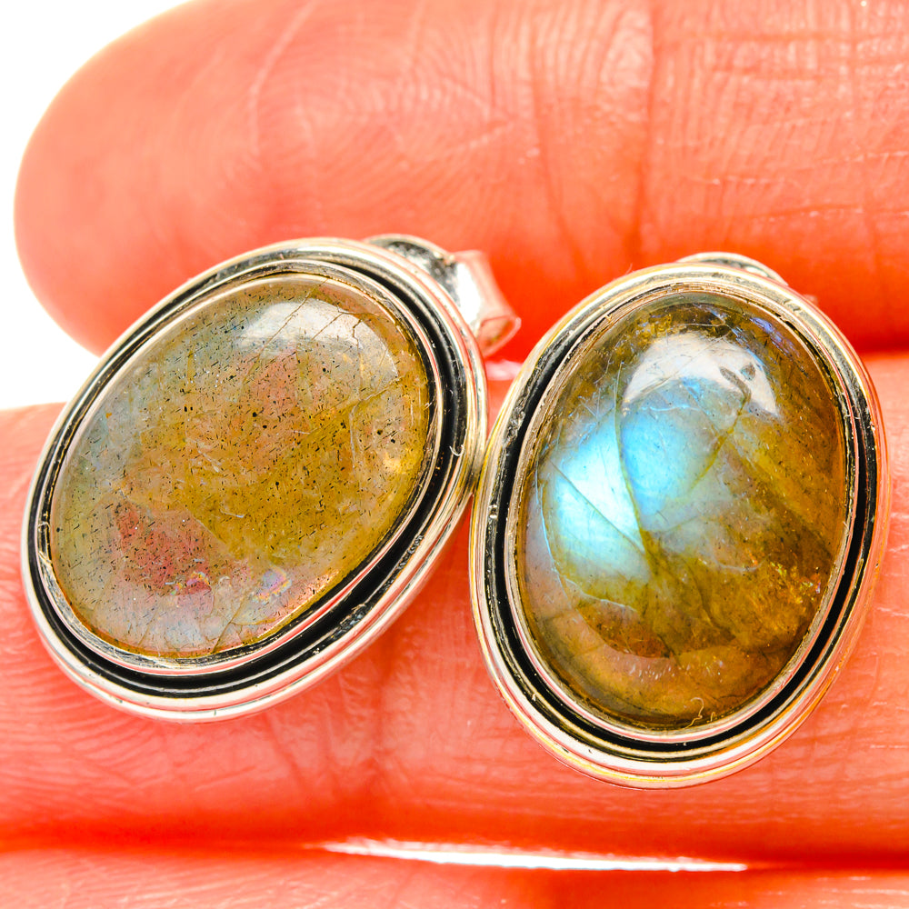 Oval labradorite earrings with polished 925 sterling silver bezel settings, close-up