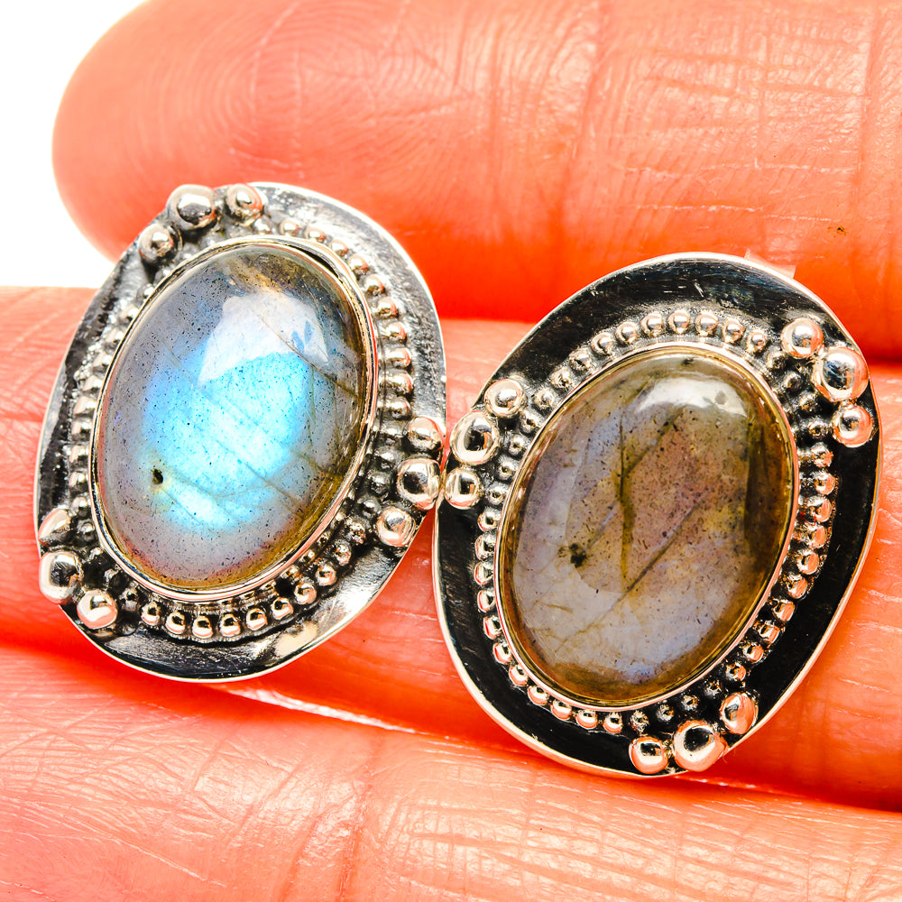 Oval labradorite stud earrings in 925 sterling silver, blue-green stones in beaded bezel.