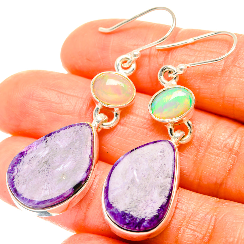 Sterling silver drop earrings with purple teardrop stone and oval opal cabochon