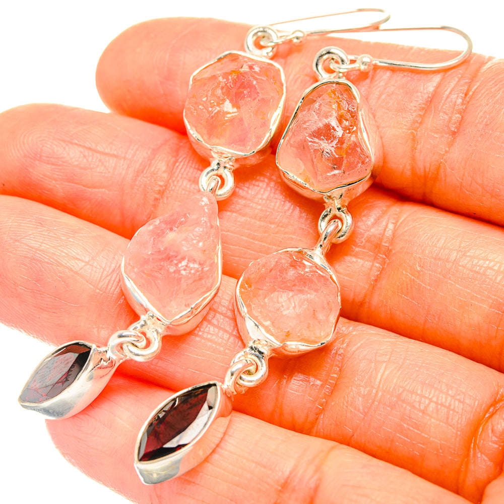 Sterling silver dangle earrings with rough pink stones and dark red teardrop drops