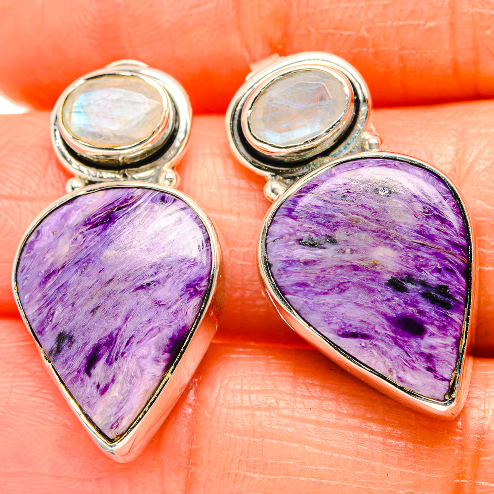 Sterling silver earrings with purple charoite teardrop stones and round moonstone tops