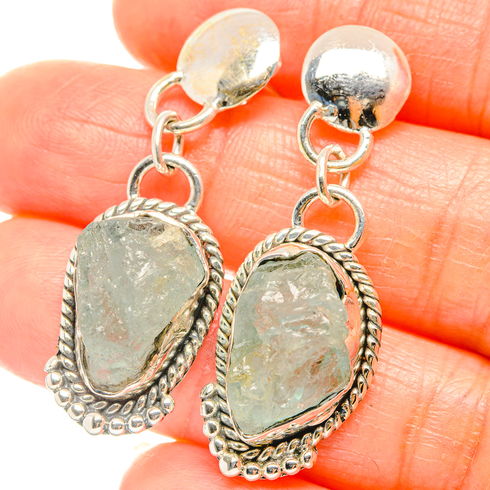 Sterling silver drop earrings with rough aquamarine oval stones and dangling loops