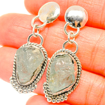 Sterling silver drop earrings with rough aquamarine oval stones and dangling loops