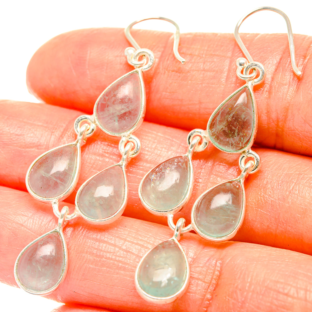 Sterling silver drop earrings with translucent teardrop stones and linked dangling drops