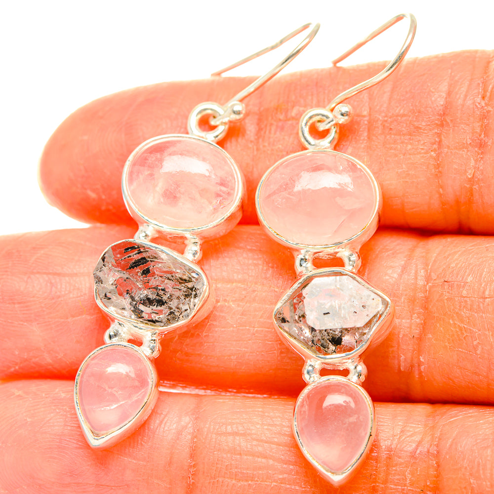 Rose quartz and clear quartz dangle earrings with round, faceted, and teardrop stones