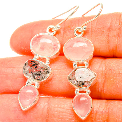 Rose quartz and clear quartz dangle earrings with round, faceted, and teardrop stones