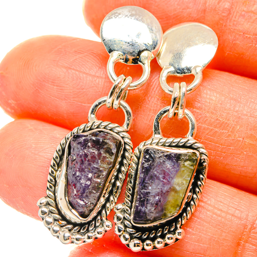Sterling silver drop earrings with rough tanzanite-style purple stone bezels, lever hooks