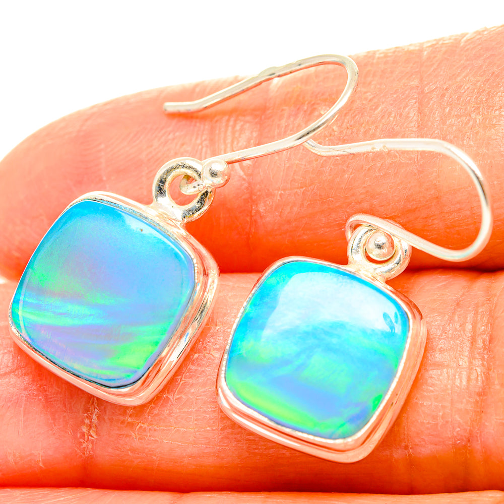 Sterling silver opal earrings with iridescent blue-green rounded-square drops
