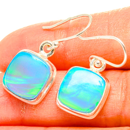 Sterling silver opal earrings with iridescent blue-green rounded-square drops