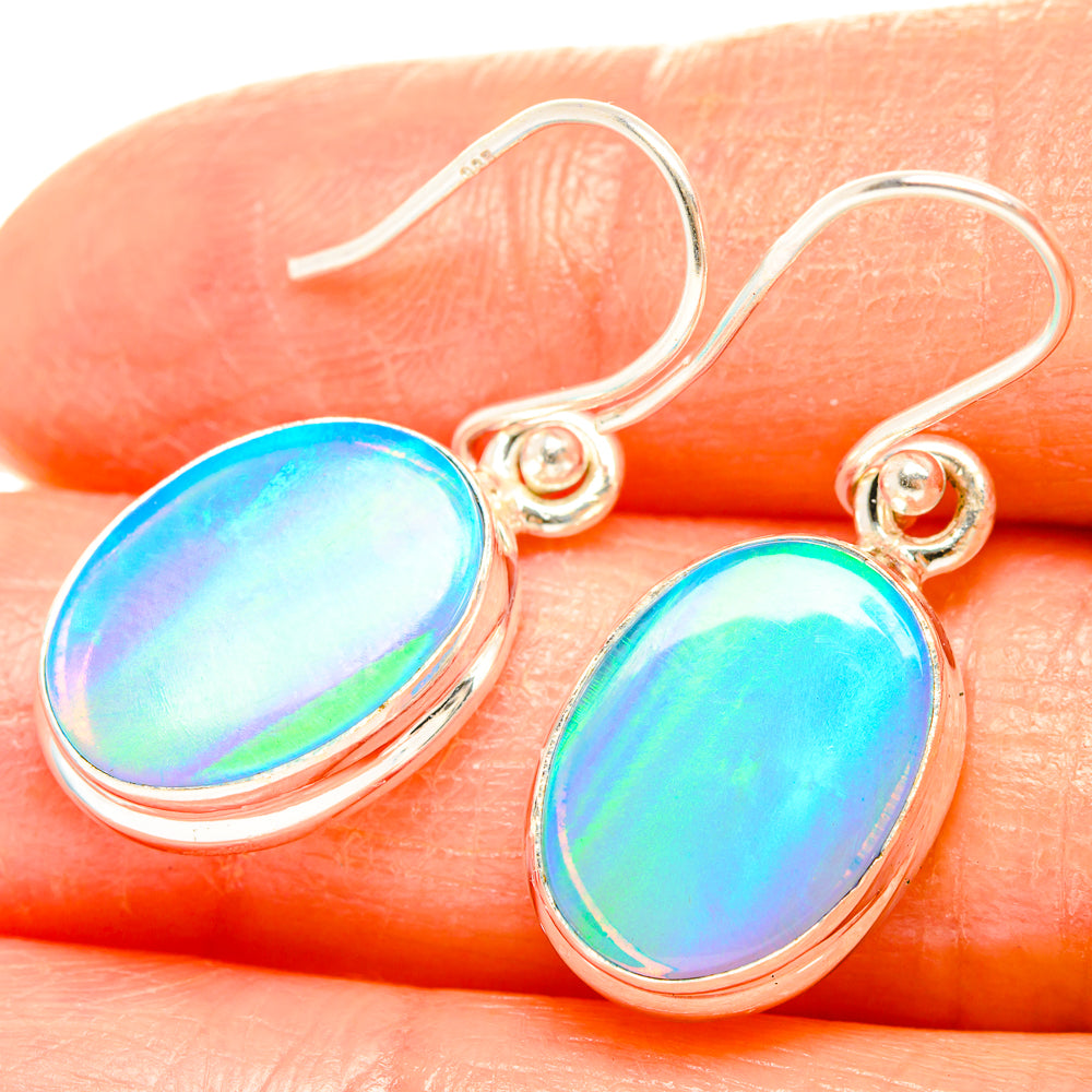 Sterling silver opal oval drop earrings, rainbow iridescent cabochons close-up