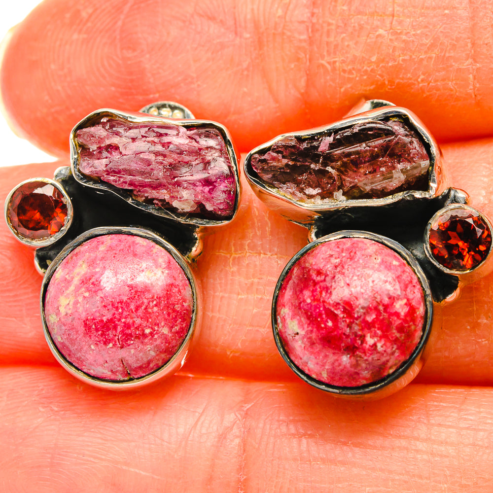 Silver gemstone earrings with round pink stone, pink rough cabochon, and garnet accents