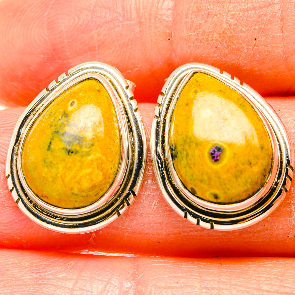 Teardrop amber earrings in 925 sterling silver with purple accent stone