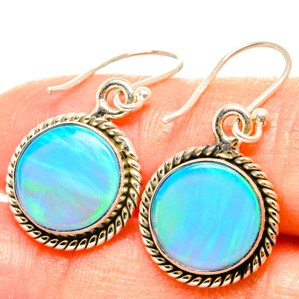 Sterling silver round opal cabochon earrings with braided bezel and fishhook backs