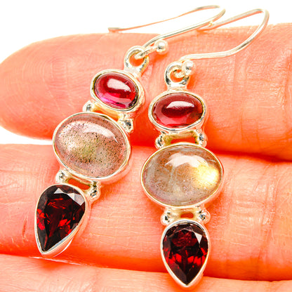 Sterling silver drop earrings with red oval stones and faceted dark red pear dangles
