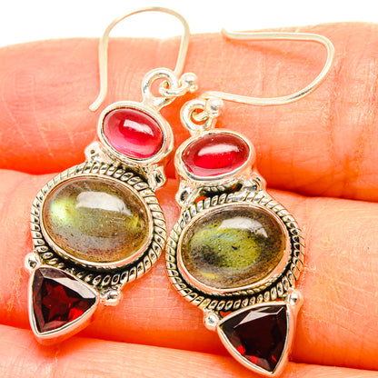 Sterling silver drop earrings with red/pink oval gems, iridescent round stones, and red triangles