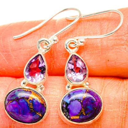 Purple amethyst teardrop earrings with oval purple stone detail; gold-tone hooks
