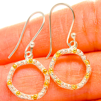 Sterling silver hoop earrings with round open circle and gold bead accents, dangle style