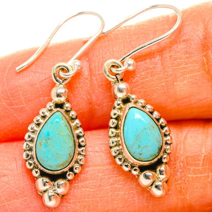 Turquoise chrysocolla teardrop earrings with ornate beaded border and silver hooks