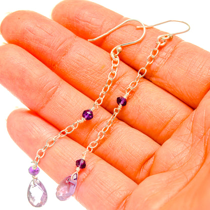 Amethyst earrings with small purple bead accents and faceted teardrop drop stones