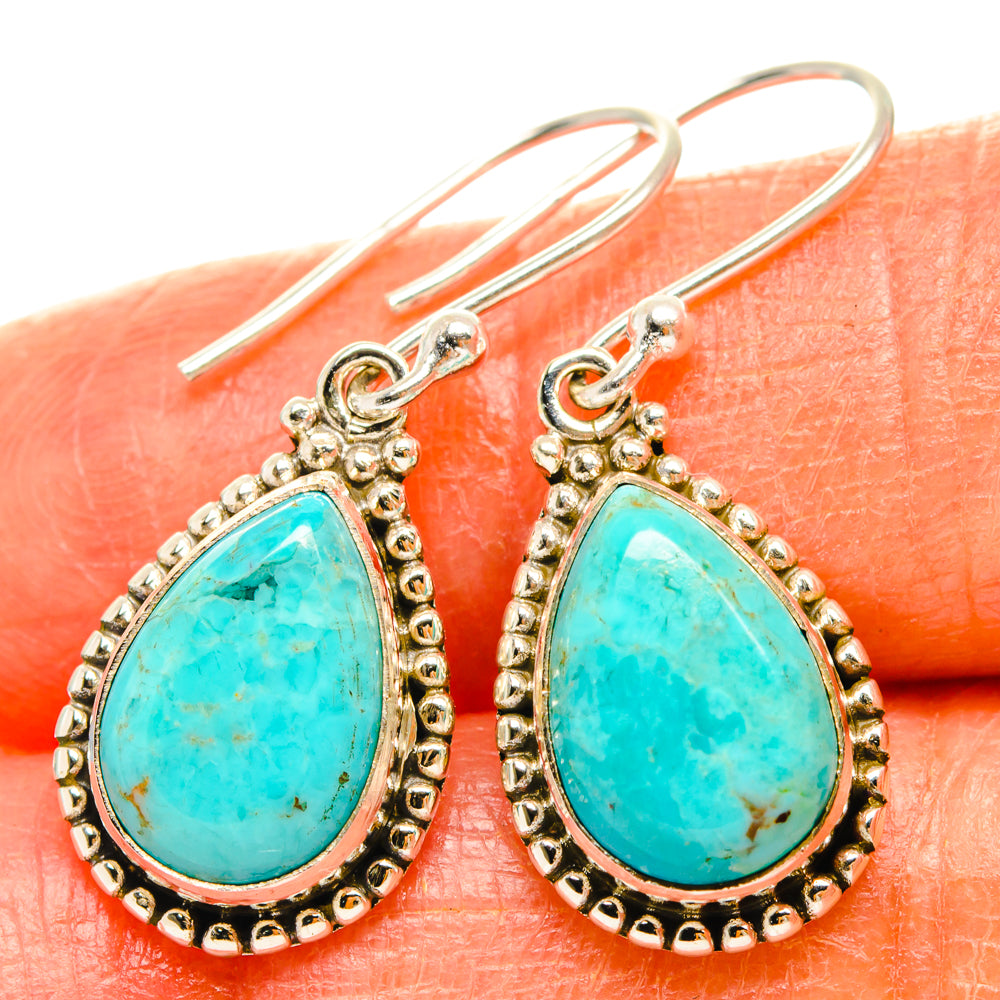 Turquoise teardrop earrings in sterling silver with beaded border and hook backs